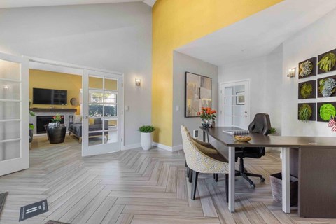 a dining room and living room with a table and chairs